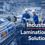 Industrial adhesive lamination film production line in Africa with printed packaging rolls and workers in manufacturing facility