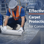 Workers applying carpet protection film in Africa construction site to protect flooring during renovation and industrial projects